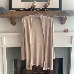 Lightweight beige colored cardigan.  100% Viscose.
